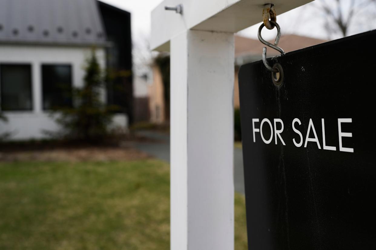 A House For Sale sign is placed in front of a home in Evanston, Ill., Wednesday, March 25, 2026. (AP Photo/Nam Y. Huh)