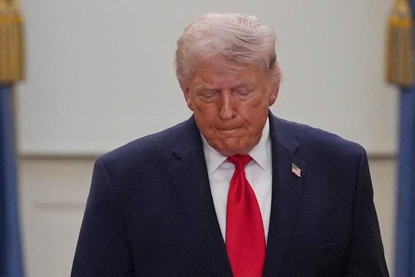 President Donald Trump leaves the Blue Room to address the Iran war from the Cross Hall of the White House on Wednesday, April 1, 2026, in Washington. (AP Photo/Alex Brandon, Pool)