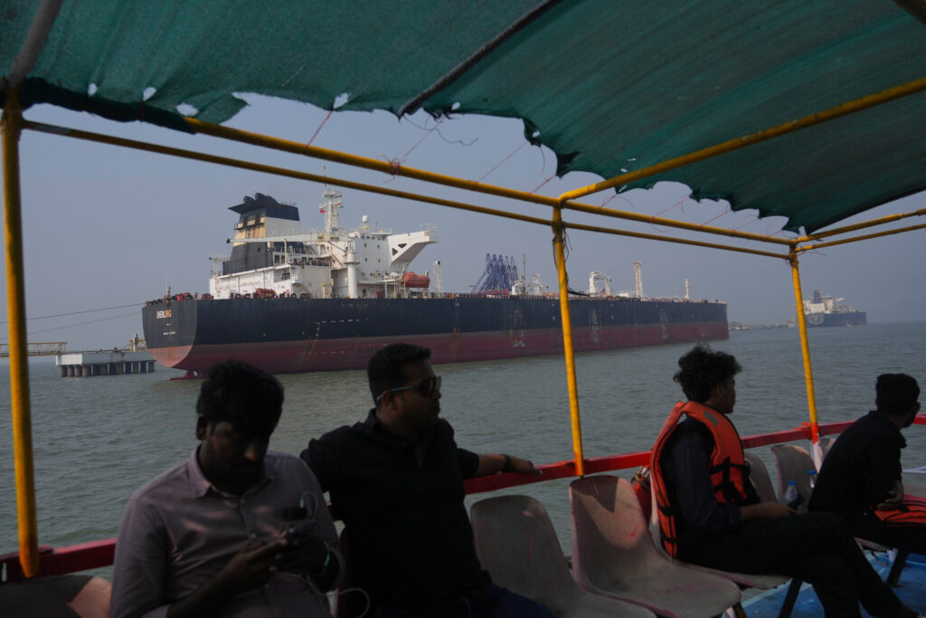 A Liberian-flagged vessel, the Shenlong Suezmax, carrying crude oil from Saudi Arabia, which arrived through the Strait of Hormuz, is seen at the port of Mumbai, in Mumbai, India, Thursday, March 12, 2026. (AP Photo/Rafiq Maqbool)